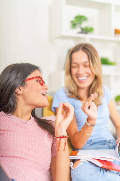 istock Happy women studying together while taking at home 2174213865