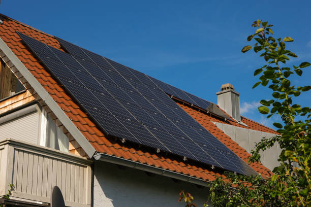 istock Black solar panels on a red tile roof 2174214491