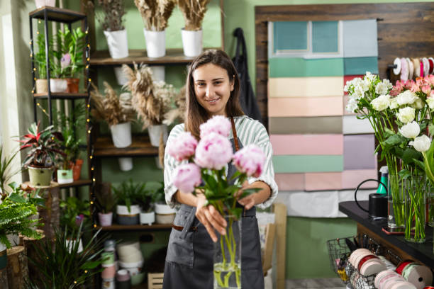 istock Young Florist Taking Pride in Beautiful Plant Arrangements 2174215993
