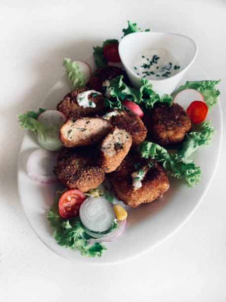 istock Meatballs, mixed salad and yogurt sauce. 2174220368