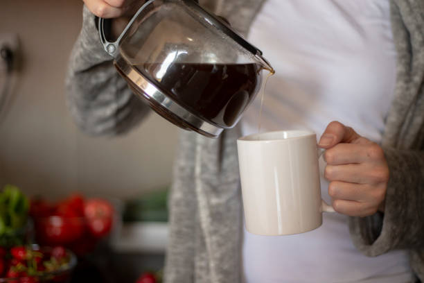 woman enjoy coffee in kitchen. Dream morning