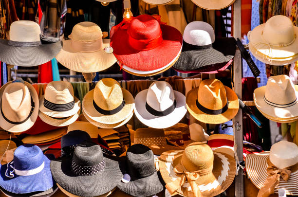 istock A row of hats on display, including a few red ones 2174222478