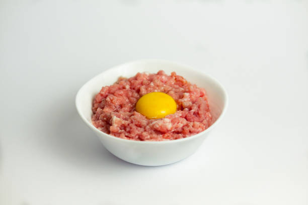 Beef steak tartare isolated on white background