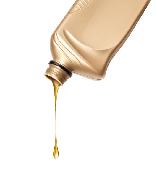 istock Stretched drop of oily liquid dripping from plastic bottle isolated on a white background 2174226366