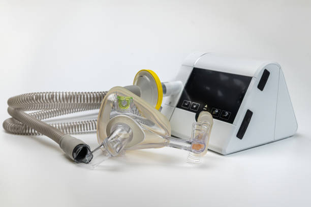 istock Continuous positive airway pressure system includes of CPAP machine, mask, tube on white background. 2174229476