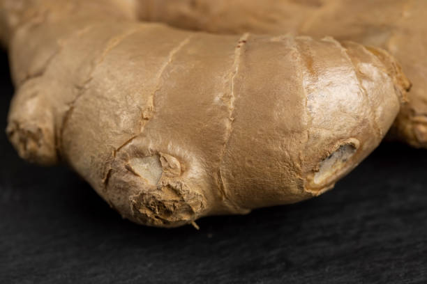 one ginger root on the table, details of the ginger root used in cooking