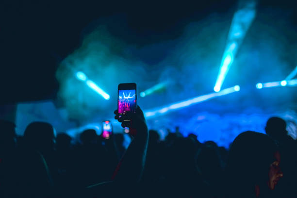 Exciting lightning during DJ party recorded by people on smartphones