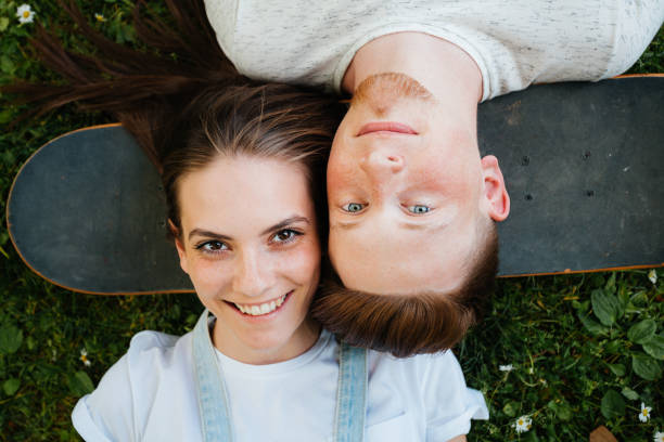 istock Young people relax on the grass 2174230859