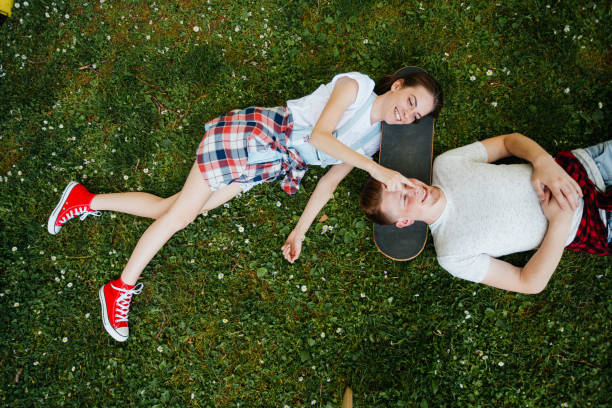 istock Young people relax on the grass 2174230892
