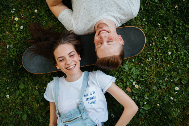 Young people relax on the grass