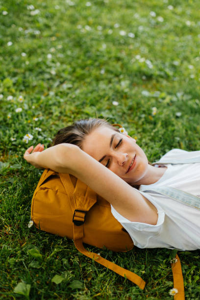 istock Young woman resting in the park 2174230961