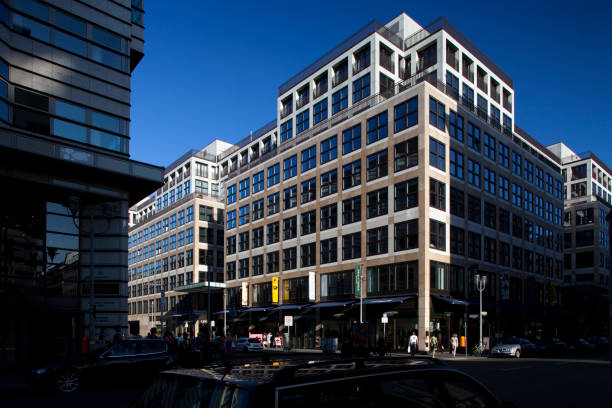 Berlin, Germany, July 27 2009, A striking modern building stands prominently on the corner of Friedrichstrasse and Taubenstrasse, showcasing contemporary design.