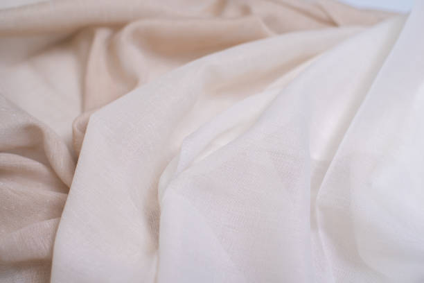 istock Samples of milk and gray fabric for tulle. Light and transparent fabric for curtains. 2174236834
