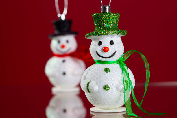 istock Snowman christmas decoration with red background 2174236950