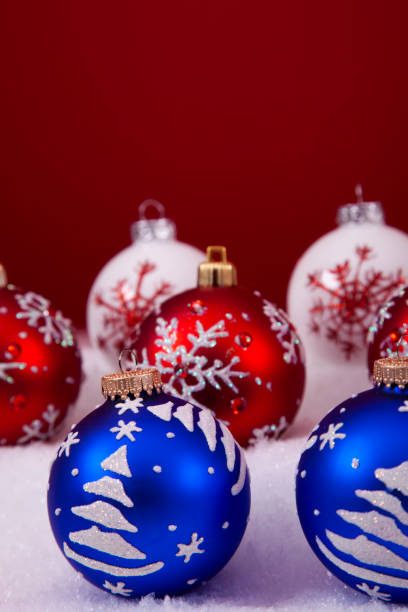Christmas white baubles on the wooden background