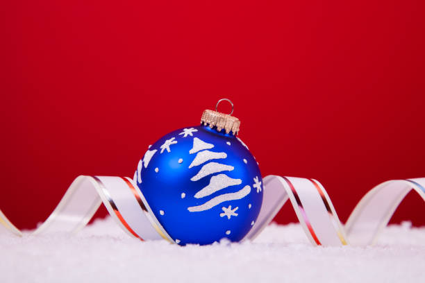 Christmas blue baubles on the wooden background
