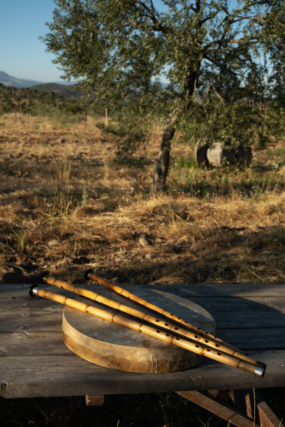 istock Ney flutes and frame drum on a wooden table in an olive grove 2174240888