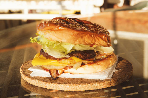 istock Close-up of homemade burger with melted cheese 2174240909