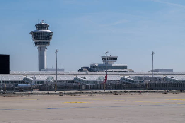 Passenger airplane taxiing on the runway at Prague Vaclav Havel Airport, ready for takeoff under a beautiful cloudy sky