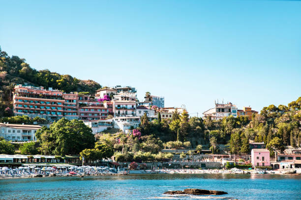 Taormina Isola Bella beach in azure waters of Ionian Sea