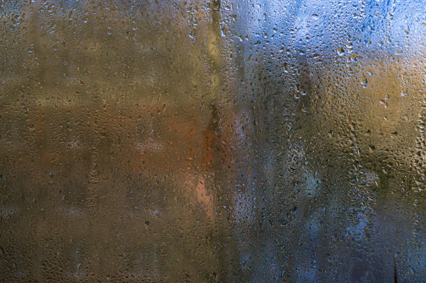 istock drops of condensation water run down the glass 2174248617