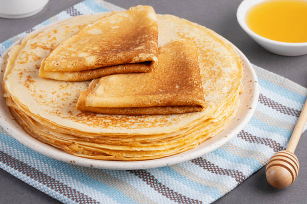 istock Stack of traditional russian pancakes blini on gray background. Homemade russian thin pancakes blini. Russian food, russian kitchen 2174249045
