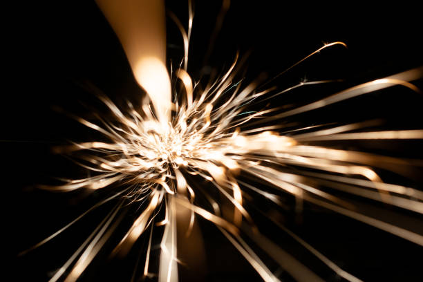 sparks from the grinder glowing in the dark straight ahead