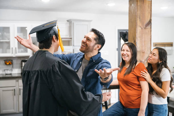 istock Proud father congratulates son on graduation day 2174258057