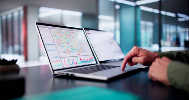 Male Data Analyst Predicting Market Trends On Virtual KPI Dashboard Male Data Analyst Predicting Market Trends On Virtual KPI Dashboard In Emerging Financial Business Concept. coming out of computer screen stock pictures, royalty-free photos & images