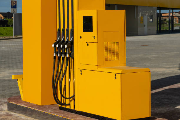 istock The bright yellow dispenser, featuring multiple hoses, is positioned at a gas station during the day, ready for vehicles to refuel conveniently 2174262691