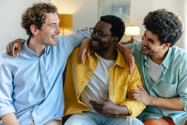 istock Joyful friends enjoying a lively conversation at home 2174263454