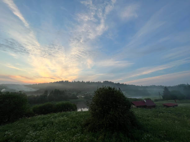 istock Fog over the river in the village, foggy evening 2174266607