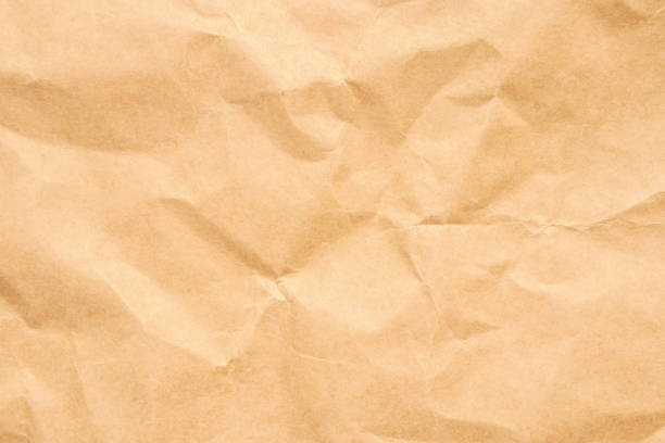 istock Abstract crumpled and creased recycle brown paper texture background 2174277785