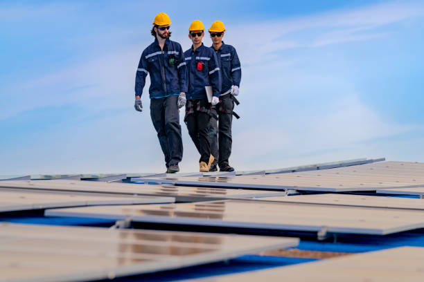 istock engineer man inspects construction of solar cell panel or photovoltaic cell by electronic device. Industrial Renewable energy of green power. factory worker working on tower roof. 2174279930