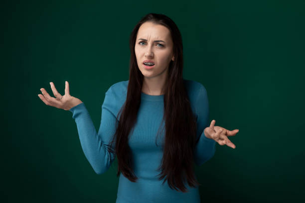 istock Woman in Blue Shirt Holding Out Her Hands 2174281165