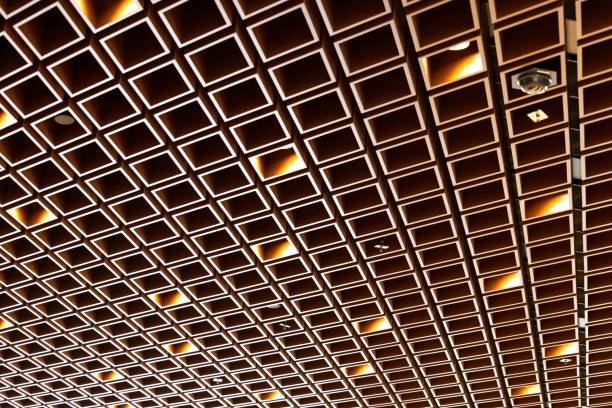 Modern ceiling with lighting equipment and fire sprinkles in subway, abstract background with copy space, Sydney Gadigal Metro station, full frame horizontal composition
