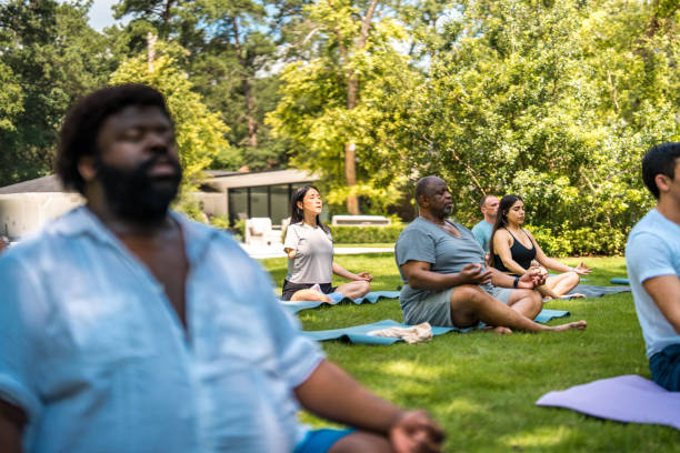 istock Diverse Yoga Group Practices Outdoors 2174282298
