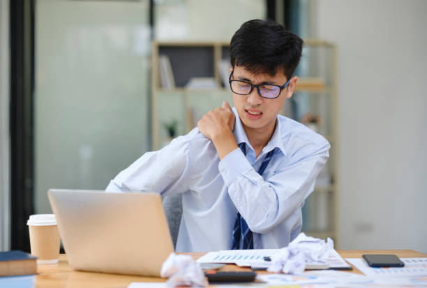 istock Exhausted Businessman Suffering Neck Pain from Work Stress 2174282623