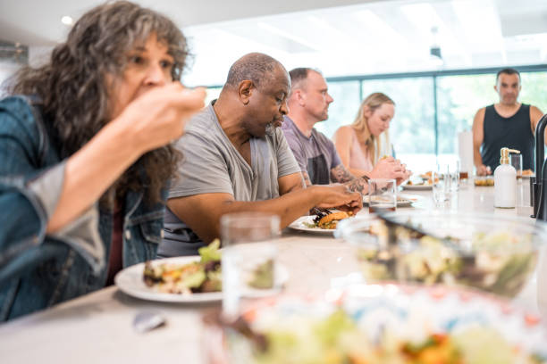 istock Diverse Group Engages in Communal Dining in Rehab Facility 2174282840