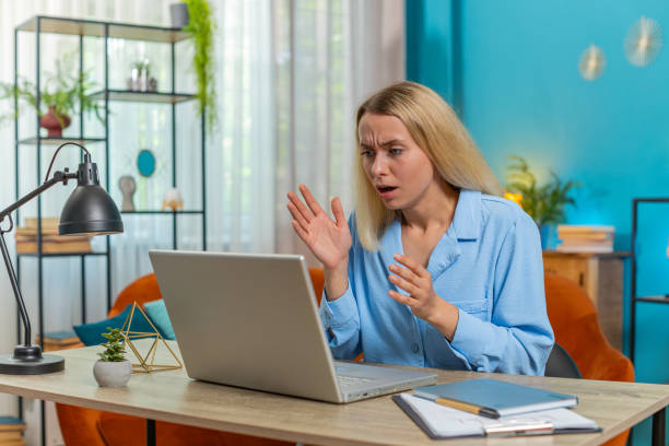 istock Frustrated woman having software problems with laptop angry girl nervous seeing error mistake virus 2174283124