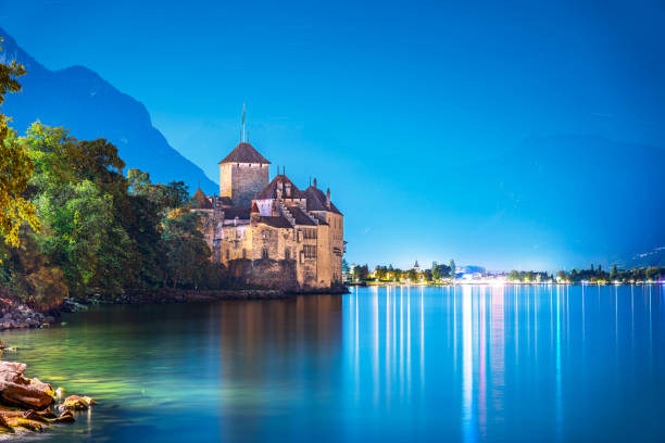 Veytaux, Switzerland- October 6, 2023: Chillon Castle on Lake Geneva at dusk. The medieval castle is one of the most visited in Switzerland.