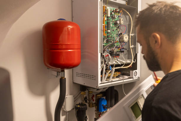 istock A man is repairing a heat pump 2174285481