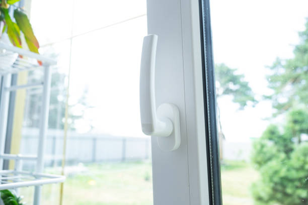 istock Window from inside the house plastic double-glazed window view outside to the sunny forest - interior salon with potted plants, clean glass after cleaning windows, closed window 2174287626
