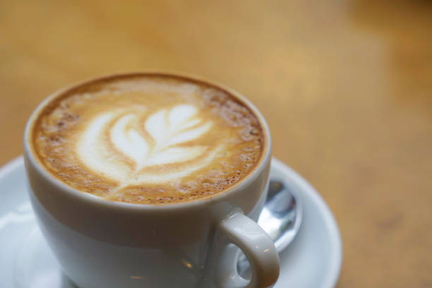 Close-up of a cappuccino coffee on a table in a cafe.