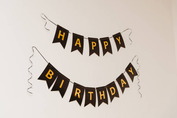 istock golden Happy Birthday letters on wall 2174288659