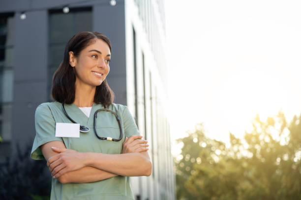 istock Dark-haired good-looking young female doctor looking contented 2174289816