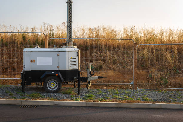 istock Mobile construction lights next to new housing development in england uk 2174290394