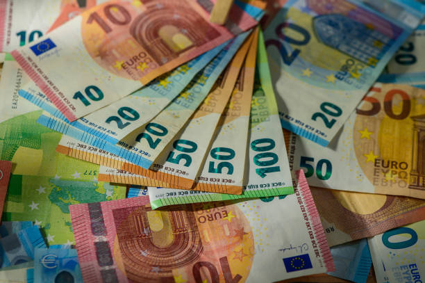 istock Several hundred euro banknotes stacked by value. Euro money con 2174293969