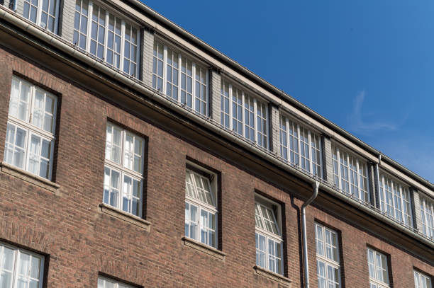 istock facade of an older brick building with windows 2174294135