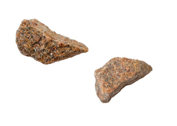 istock Two pieces of broken falling stones isolated on white 2174294604